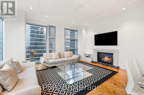 2503 - 183 Wellington Street W, Toronto, ON - Indoor Photo Showing Living Room With Fireplace