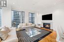 2503 - 183 Wellington Street W, Toronto, ON  - Indoor Photo Showing Living Room With Fireplace 