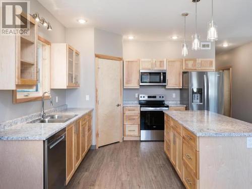 22 Beryl Place, Whitehorse, YT - Indoor Photo Showing Kitchen With Stainless Steel Kitchen With Double Sink With Upgraded Kitchen