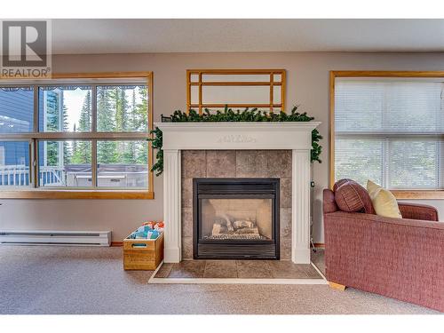 465 Silver Queen Road Unit# A, Vernon, BC - Indoor Photo Showing Living Room With Fireplace