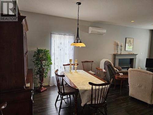 9800 Turner Street Unit# 50, Summerland, BC - Indoor Photo Showing Dining Room With Fireplace