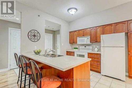 305 - 391 Plains Road E, Burlington, ON - Indoor Photo Showing Kitchen With Double Sink