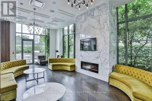 207 - 775 King Street W, Toronto, ON - Indoor Photo Showing Living Room With Fireplace