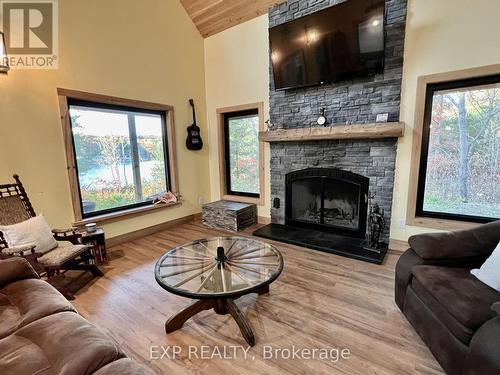 1249 Waters Edge Lane, Central Frontenac, ON - Indoor Photo Showing Living Room With Fireplace