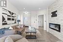 174 Kostiuk Crescent, Saskatoon, SK  - Indoor Photo Showing Living Room With Fireplace 