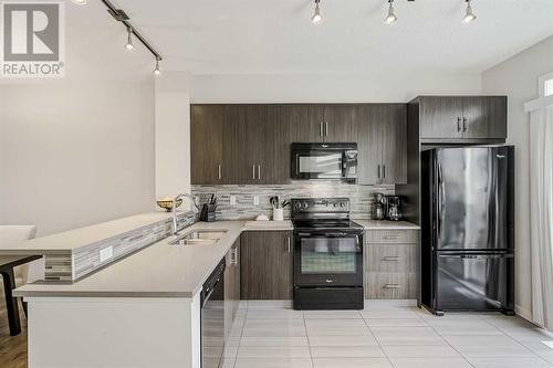 118 Walden Circle Se, Calgary, AB - Indoor Photo Showing Kitchen With Double Sink