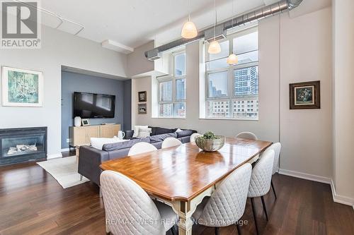 821 - 155 Dalhousie Street, Toronto, ON - Indoor Photo Showing Dining Room With Fireplace