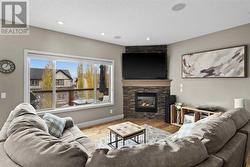 Adjacent to the kitchen is the spacious living room complete with a Valor corner fireplace - 