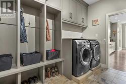 Main level mud room with built-in cabinetry and convenient laundry - 