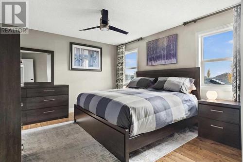 3 bedrooms are upstairs including the generously sized primary - 209 Hidden Creek Road Nw, Calgary, AB - Indoor Photo Showing Bedroom