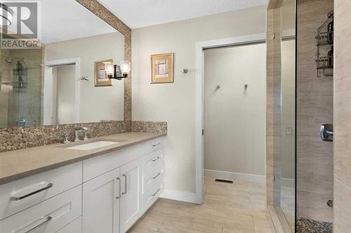 The spa inspired 3-piece ensuite features heated flooring and a dedicated water closet - 209 Hidden Creek Road Nw, Calgary, AB - Indoor Photo Showing Bathroom