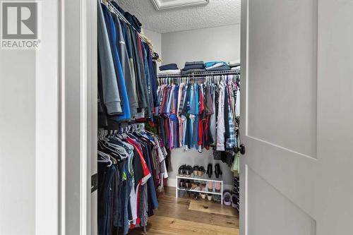 Spacious walk-in closet - 209 Hidden Creek Road Nw, Calgary, AB - Indoor With Storage