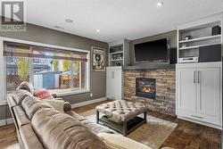 Watch the newest release or your favourite team in the media room with built in cabinetry surrounding the stone fireplace - 