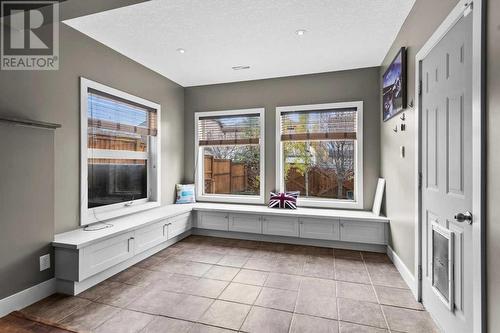 Easy to clean tile flooring when the little ones are running in from the outside - 209 Hidden Creek Road Nw, Calgary, AB - Indoor Photo Showing Other Room