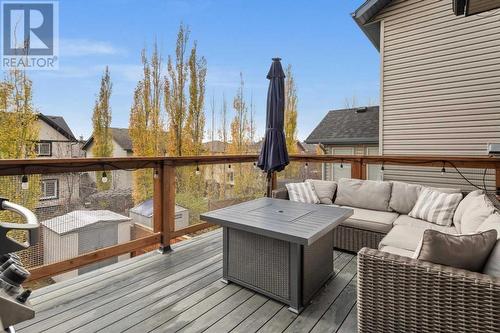 Enjoy a morning coffee or visit with friends in the summer evenings on the upper deck - 209 Hidden Creek Road Nw, Calgary, AB - Outdoor With Deck Patio Veranda With Exterior