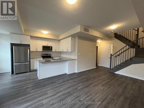 111 - 1573 Rose Way, Milton, ON - Indoor Photo Showing Kitchen