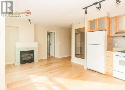 1403 1003 Burnaby Street, Vancouver, BC - Indoor Photo Showing Kitchen With Fireplace