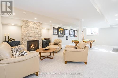 4454 North Valley Lane, Severn, ON - Indoor With Fireplace