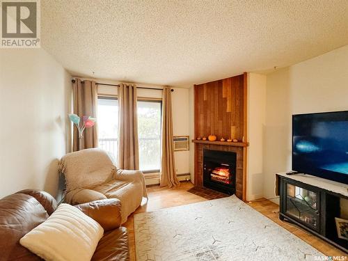 301 275 Kingsmere Boulevard, Saskatoon, SK - Indoor Photo Showing Living Room With Fireplace