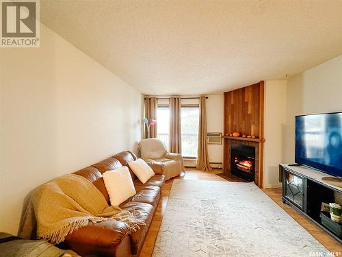 301 275 Kingsmere Boulevard, Saskatoon, SK - Indoor Photo Showing Living Room With Fireplace