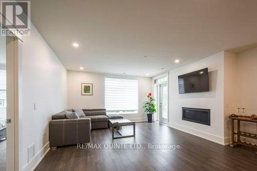 407 - 17 Cleave Avenue, Prince Edward County (Picton), ON - Indoor Photo Showing Living Room With Fireplace