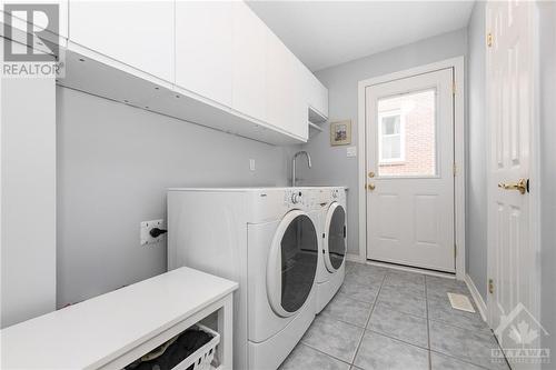 Handy laundry/mud room with outside access - 40 Byrd Crescent, Kanata, ON - Indoor Photo Showing Laundry Room