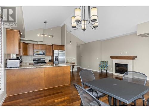 2142 Vasile Road Unit# 412, Kelowna, BC - Indoor Photo Showing Kitchen With Fireplace