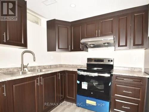 Bsmt - 10 Lockheed Crescent, Brampton, ON - Indoor Photo Showing Kitchen With Double Sink