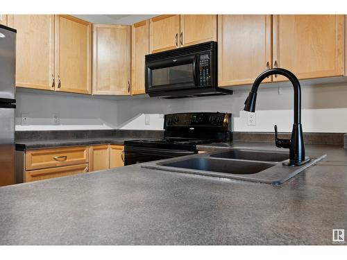 #308 13830 150 Av Nw, Edmonton, AB - Indoor Photo Showing Kitchen With Double Sink