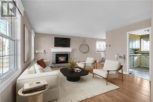 virtually staged - 1505 Second Street E, Cornwall, ON - Indoor Photo Showing Living Room With Fireplace