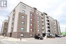 728 Brownstone Unit# 409, Lakeshore, ON  - Outdoor With Balcony With Facade 