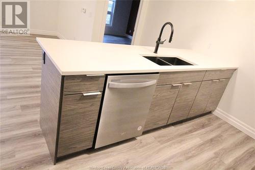 728 Brownstone Unit# 409, Lakeshore, ON - Indoor Photo Showing Kitchen With Double Sink