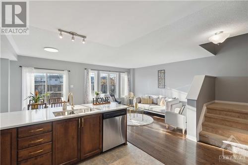 Spacious Open Concept Dining and Living Room - 642 Pepperville Crescent, Ottawa, ON - Indoor Photo Showing Kitchen With Double Sink