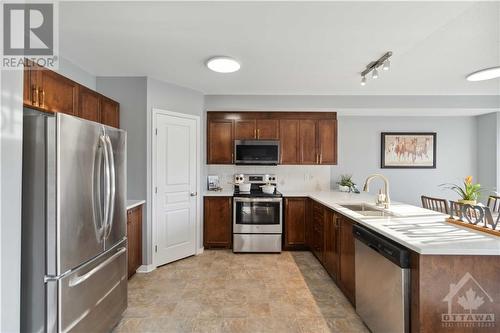 Updated Fridge & Refaced Cabinets - 642 Pepperville Crescent, Ottawa, ON - Indoor Photo Showing Kitchen