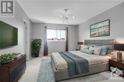 Virtually staged, Naturally Bright Primary Bedroom with Walk-in Closet and a 4 piece Ensuite - 642 Pepperville Crescent, Ottawa, ON - Indoor Photo Showing Bedroom