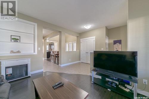 3366 Green Moss Lane, Regina, SK - Indoor Photo Showing Living Room With Fireplace