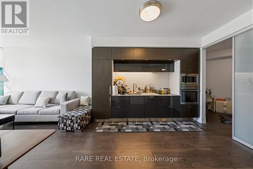 312 - 1 Edgewater Drive, Toronto, ON - Indoor Photo Showing Living Room With Fireplace