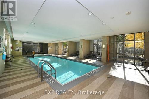 724 - 2480 Prince Michael Drive, Oakville, ON - Indoor Photo Showing Other Room With In Ground Pool