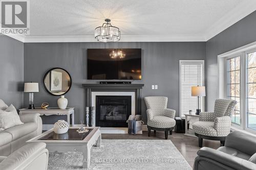 8670 Crayton Court, North Perth, ON - Indoor Photo Showing Living Room With Fireplace