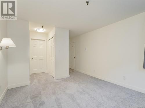 Master Bedroom with walk through closet to full ensuite bathroom - 106 1110 Oscar St, Victoria, BC - Indoor Photo Showing Other Room