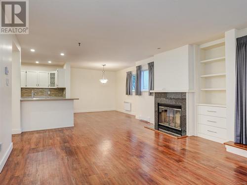 Open living/dining room view - 106 1110 Oscar St, Victoria, BC - Indoor With Fireplace