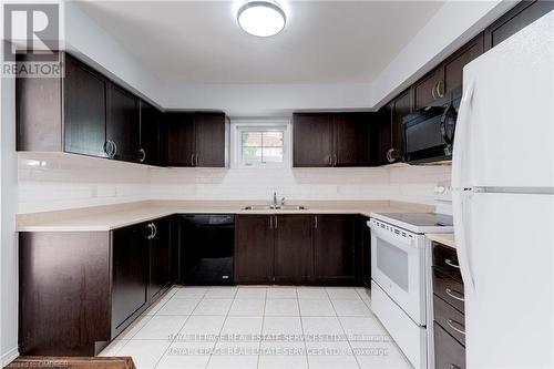 20 - 2460 Post Road, Oakville, ON - Indoor Photo Showing Kitchen With Double Sink