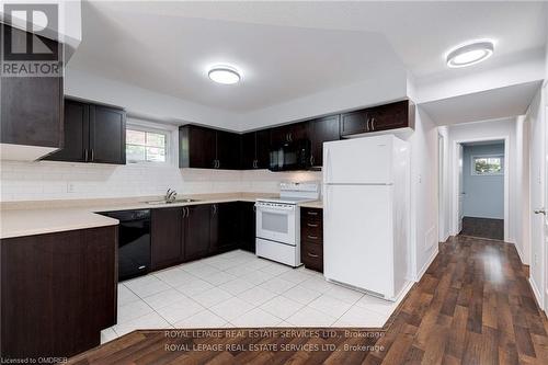 20 - 2460 Post Road, Oakville, ON - Indoor Photo Showing Kitchen With Double Sink