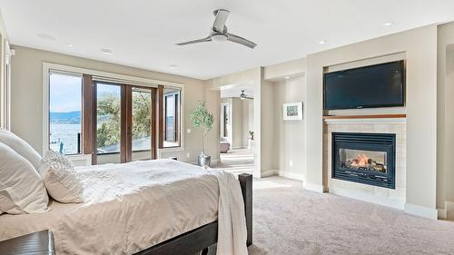 4100 Lakeshore Road, Kelowna, BC - Indoor Photo Showing Bedroom With Fireplace