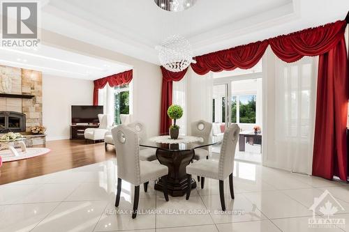 699 Ballycastle Crescent, Ottawa, ON - Indoor Photo Showing Dining Room With Fireplace