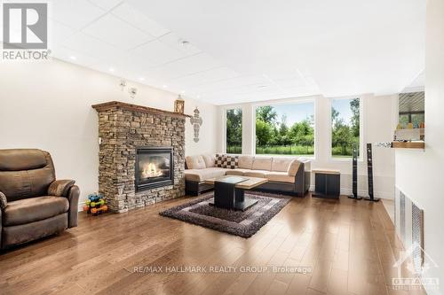 699 Ballycastle Crescent, Ottawa, ON - Indoor Photo Showing Living Room With Fireplace