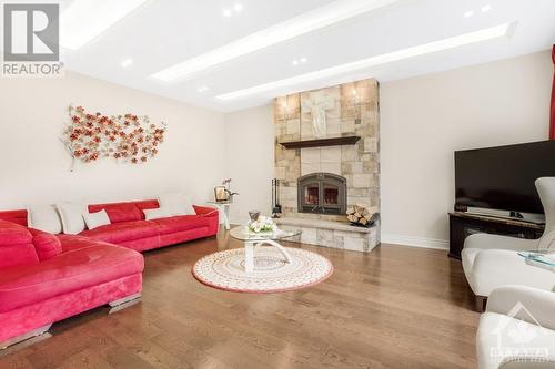 699 Ballycastle Crescent, Ottawa, ON - Indoor Photo Showing Living Room With Fireplace