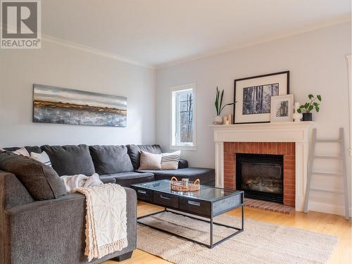 723 Carling Road, Dawson Creek, BC - Indoor Photo Showing Living Room With Fireplace