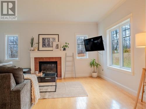 723 Carling Road, Dawson Creek, BC - Indoor Photo Showing Living Room With Fireplace