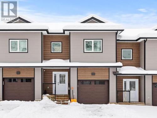 107-113 Mallard Way, Whitehorse, YT - Outdoor With Facade